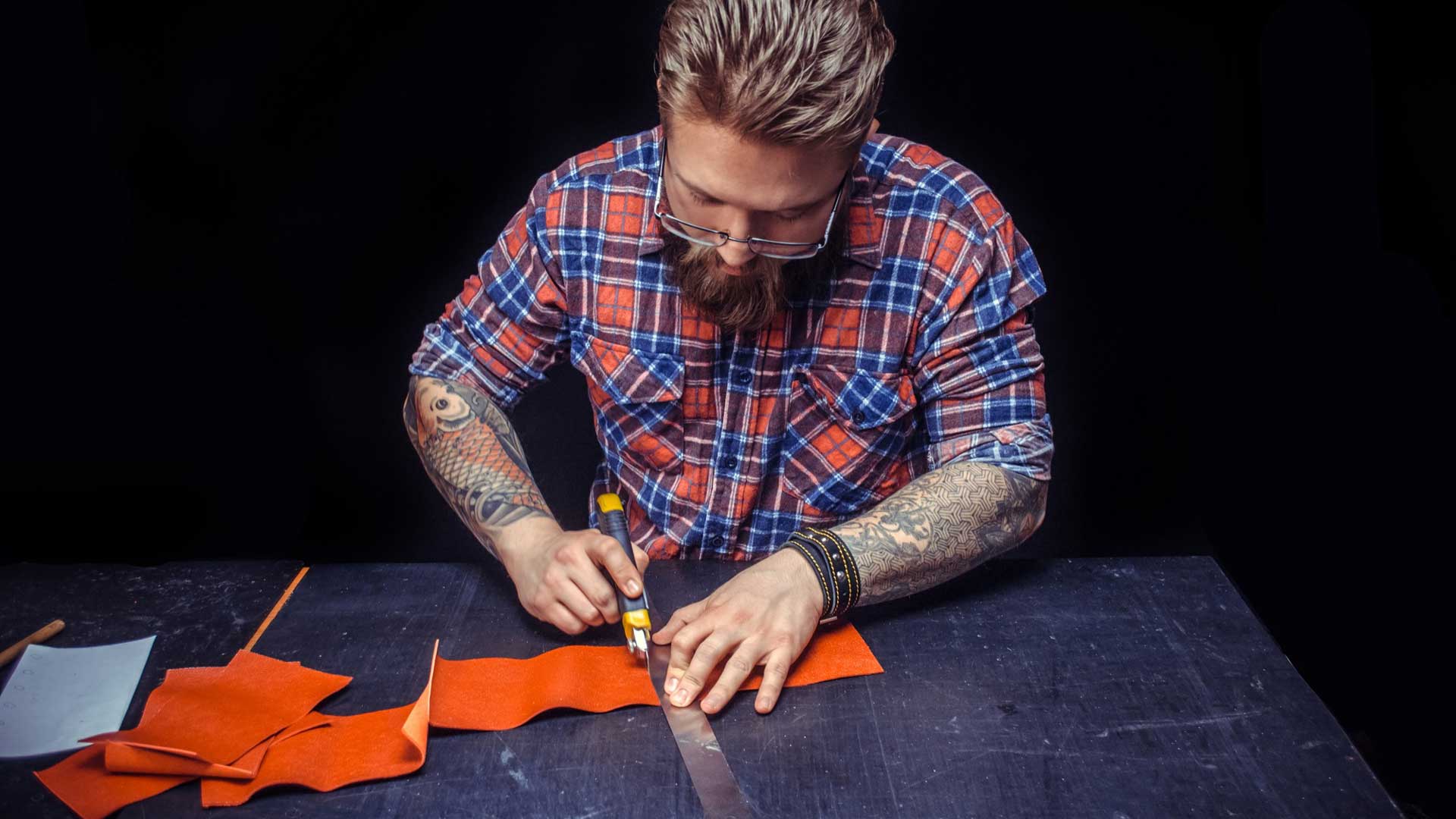 craftsman-working-with-leather-creates-new-leatherwork-his-leather-studio